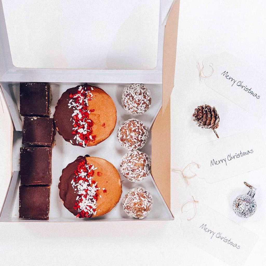Orla's Origins Christmas box made up of 4 salted caramel choc chip balls, 4 orange millionaires and 2 bounty cheesecakes.