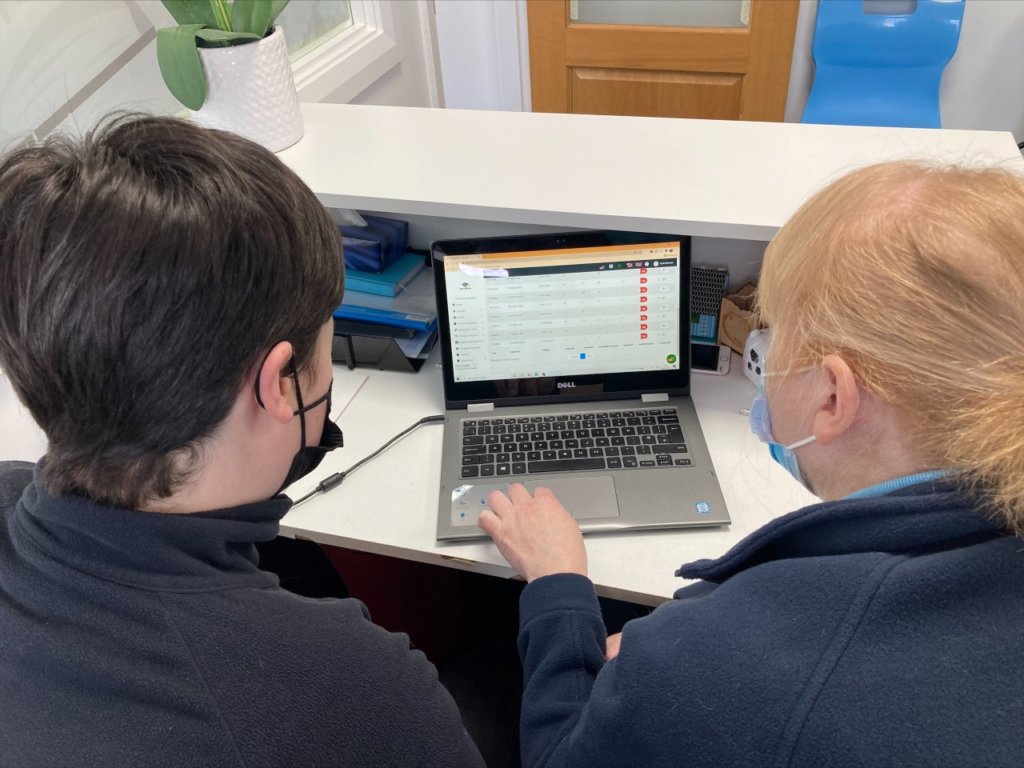 NWRC ICT and Software Development Technical Consultant Sarah Gillespie taking the receptionist at Foyle Kumon through the functionalities of the Genius One product.