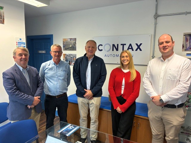 A group of people standing in a room