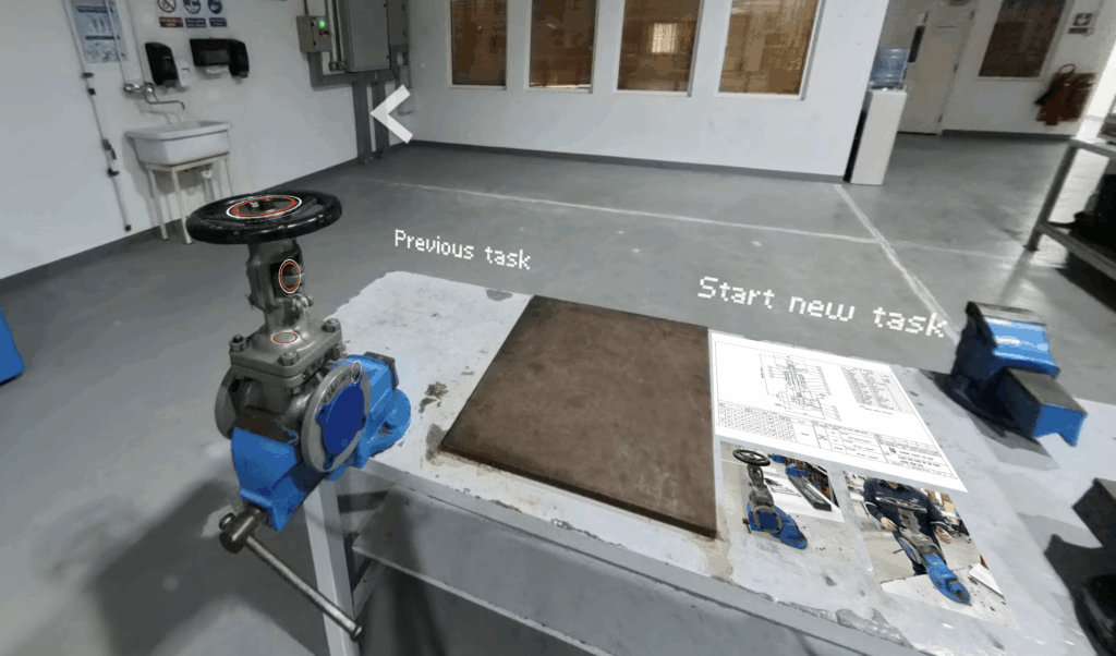 A blue and black machine on a table.